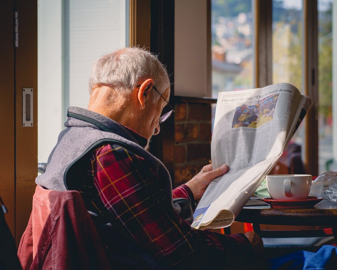 person reading newspaper